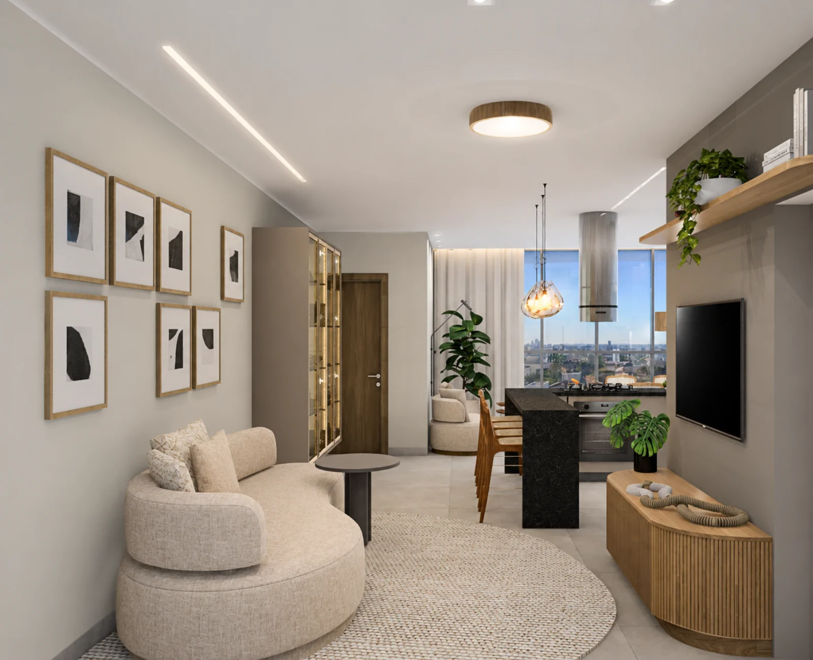 Living integrado com sofá curvo, home theater e vista para a cozinha do RAMGAD Residence